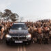 Amabutho (Zulu regiments) sing and chant praises in front of a convoy carrying the coffin of Mangosuthu Buthelezi, traditional prime minister of the Zulu monarch and nation, as it passes through Mahlabathini on its way to his family’s rural home at Kwa-Phindangene, in Ulundi on September 15, 2023, a day before his funeral. (Photo by RAJESH JANTILAL / AFP)