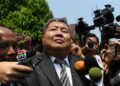 (FILES) Thai tycoon Premchai Karnasuta leaves court after hearing the verdict against him and three other suspects in a poaching case at Thong Pha Phum Provincial Court in Kanchanaburi province on March 19, 2019. – Thai construction magnate Premchai Karnasuta, who was convicted of poaching wildlife in a national park, will be released from prison more than a year early, the corrections department said October 17, 2023. (Photo by Lillian Suwanrumpha / AFP)