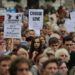 Demonstrators listen to speeches after taking part in a march calling for the British parliament to welcome refugees in the UK in central London on September 17, 2016. Thousands marched in central London calling on the British government to do more to help refugees fleeing conflict and persecution. (Photo by Daniel LEAL / AFP)