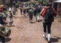 Residents of Bambo in Rutshuru territory, 60 kilometers north of Goma, the capital of North Kivu, eastern Democratic Republic of Congo, flee as the M23 attacked the town on October 26, 2023. – Around noon, M23 rebels, supported by the Rwandan army according to the UN, the USA and the European Union, attacked the town of Bambo with mortars, causing several thousand inhabitants to flee. (Photo by ALEXIS HUGUET / AFP)