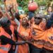 Supporters of incumbent Madagascar President Andry Rajoelina, candidate in the 2023 presidential election, greet him during his re-election campaign, in Toamasina, November 11, 2023. (Photo by RIJASOLO / AFP)