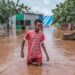 A Somali boy moves through floodwaters in Dolow on November 25, 2023. – East Africa is experiencing torrential rainfall and floods linked to El Ni–o climate pattern. Hundreds of thousands have been forced to flee their homes after the devastating floods caused by the heavy rains struck parts of the Horn of Africa, exacerbating the already existing humanitarian crisis in Somalia. (Photo by Hassan Ali Elmi / AFP)