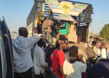 People displaced by the conflict in Sudan get in their transporation as they flee Wad Madani, the capital of al-Jazirah state, heading to Gadaref state on December 16, 2023. – Fighting between the Sudanese army and paramilitaries engulfed the aid hub of Wad Madani on December 15, triggering an exodus of civilians already displaced by eight months of war, an AFP correspondent reported. (Photo by AFP)