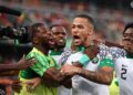 Nigeria’s defender #5 William Troost-Ekong (C) celebrates after shooting a penalty and scoring his team’s first goal during the Africa Cup of Nations (CAN) 2024 group A football match between Ivory Coast and Nigeria at the Alassane Ouattara Olympic Stadium in Ebimpe, Abidjan, on January 18, 2024. (Photo by FRANCK FIFE / AFP)