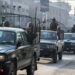 A Pakistan Army convoy patrols along a road in Peshawar on February 7, 2024, a day prior Pakistan's national elections. (Photo by Abdul MAJEED / AFP)