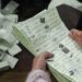 Election officials count ballot papers after polls closed at a polling station during Pakistan national election in Lahore on February 8, 2024. – Pakistan suspended mobile phone and data services nationwide on February 8 for election day, in a move a digital rights group said was “inherently undemocratic”. (Photo by Aamir QURESHI / AFP)
