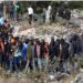 Onlookers gather at the dumpsite where six bodies were found in the landfill in Mukuru slum, Nairobi, on July 12, 2024. (AFP)